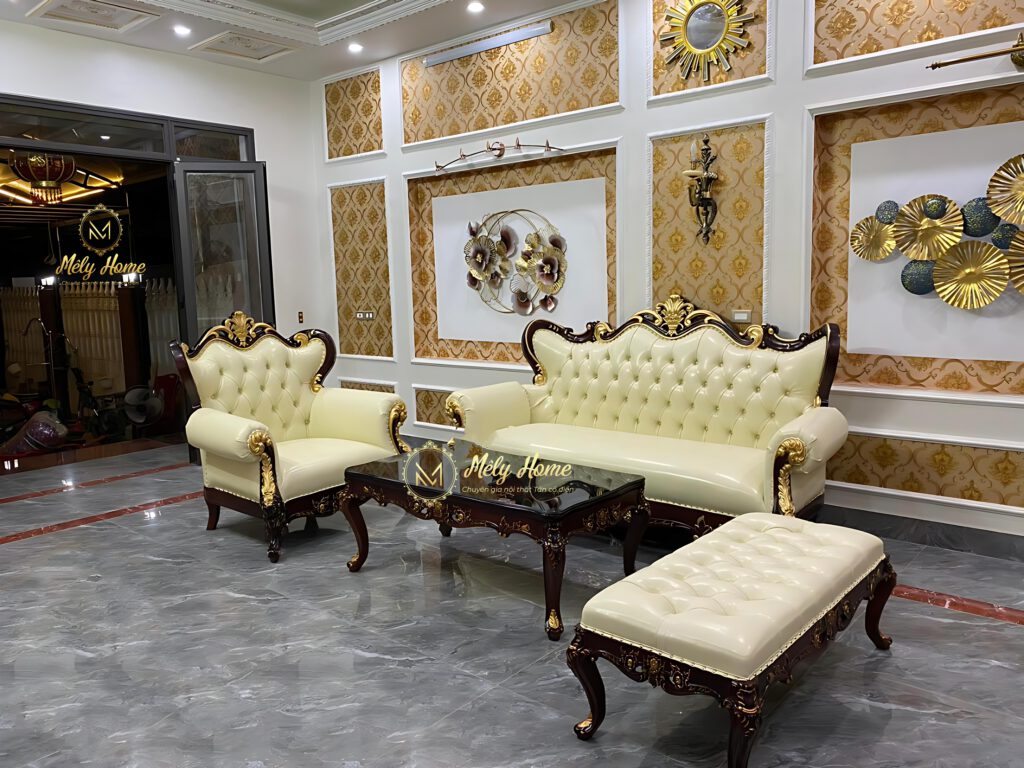 Bộ sofa tân cổ điển cao cấp gỗ tự nhiên gồm văng dài 2m2, ghế đơn rộng 1m bàn trà dài 1m2, đôn dài 1m2, khung phun màu đen, bọc da màu kem sang trọng