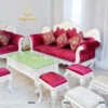 Bộ sofa tân cổ điển giá rẻ khung màu trắng, bọc nhung màu đỏ nổi bật, gồm 1 văng dài, 1 ghế đơn, 1 bàn trà và 3 đôn nhỏ
