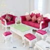 Bộ sofa tân cổ điển giá rẻ khung màu trắng, bọc nhung màu đỏ nổi bật, gồm 1 văng dài, 1 ghế đơn, 1 bàn trà và 3 đôn nhỏ