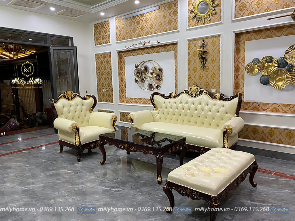 Bộ sofa tân cổ điển cao cấp gỗ tự nhiên gồm văng dài 2m2, ghế đơn rộng 1m bàn trà dài 1m2, đôn dài 1m2, khung phun màu đen, bọc da màu kem sang trọng